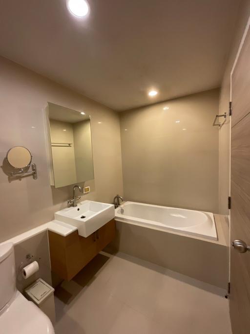 Modern bathroom interior with sink, toilet, and bathtub