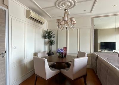Elegant dining room with contemporary decor and wooden flooring