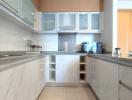 Modern kitchen with marble countertops and ample cabinetry