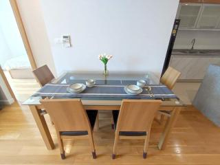 Modern kitchen with dining area and stainless steel appliances