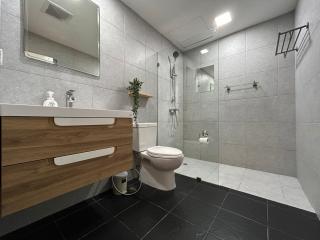 Modern spacious bathroom with walk-in shower and stylish vanity