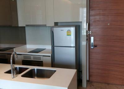 Modern kitchen with stainless steel appliances and wooden finishes