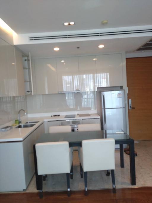 Modern kitchen with dining area and stainless steel appliances