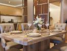 Elegant dining room with a modern table set and open concept kitchen