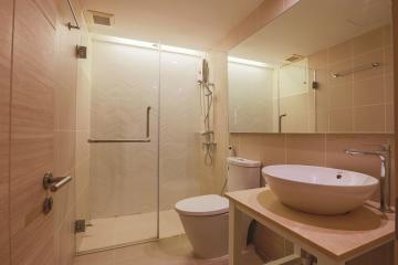 Modern bathroom with shower and warm lighting