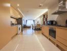 Modern kitchen with open floor plan extending to living and dining area