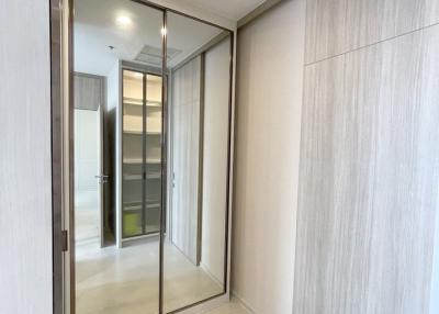 Modern corridor with tiled floor and sliding glass door