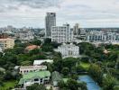 Scenic city view overlooking green spaces and high-rise buildings