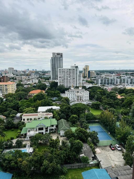 Scenic city view overlooking green spaces and high-rise buildings