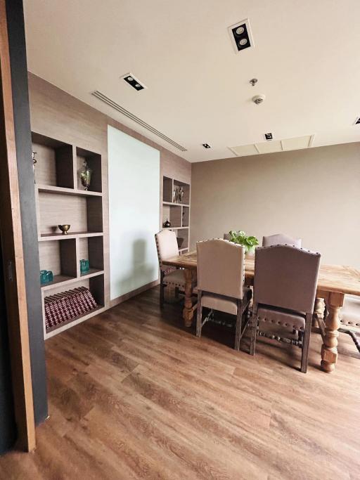 Spacious dining room with wooden flooring and modern decor