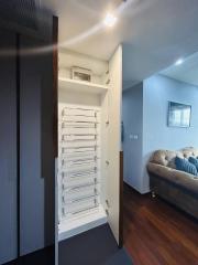 Modern hallway interior with floating staircase and bright lighting