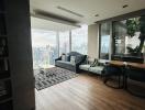 Spacious living room with large windows and city view