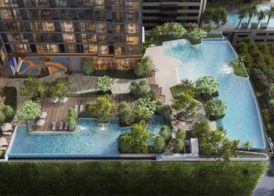 aerial view of a modern residential building complex with swimming pool and outdoor amenities