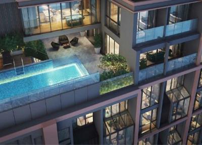 Modern residential building with illuminated interiors and outdoor swimming pool at dusk