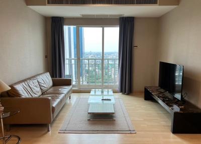 Spacious living room with cityscape view through large window