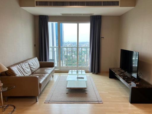 Spacious living room with cityscape view through large window