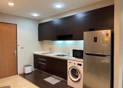 Modern kitchen with stainless steel appliances and ample cabinetry