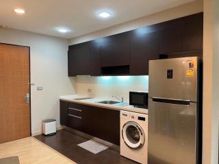 Modern kitchen with stainless steel appliances and ample cabinetry