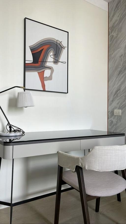 Modern home office with sleek desk and contemporary art