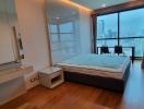 Modern bedroom with city view and ample lighting