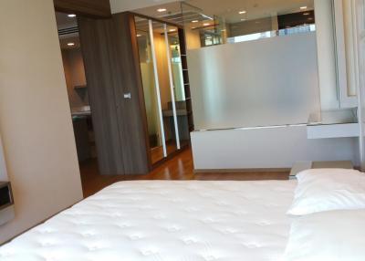 Modern bedroom with large bed and en suite bathroom