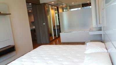 Modern bedroom with large bed and en suite bathroom