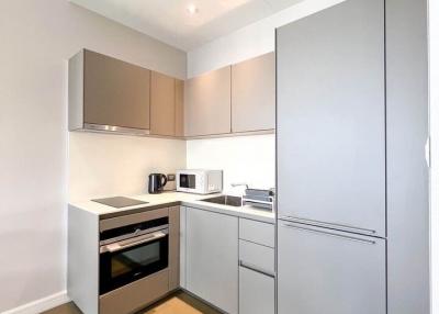 Modern kitchen with stainless steel appliances and wooden cabinets