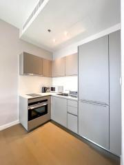 Modern kitchen with stainless steel appliances and wooden cabinets