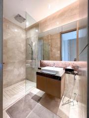 Modern bathroom with walk-in shower and stylish vanity