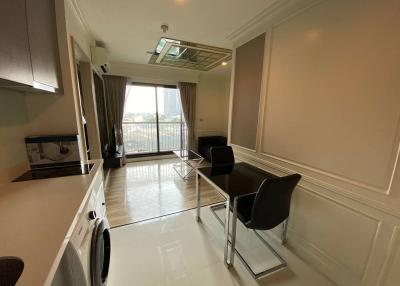 Bright and spacious living room with balcony access