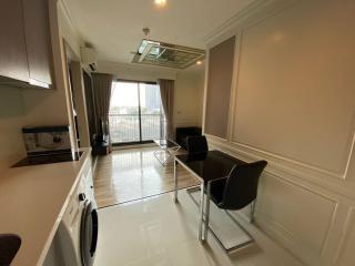 Bright and spacious living room with balcony access