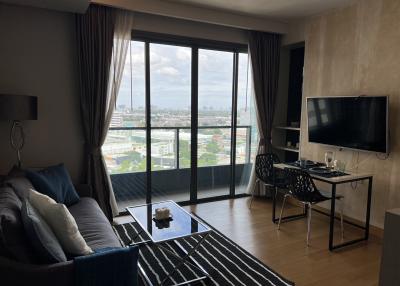 Modern living room with city view through large windows