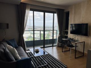 Modern living room with city view through large windows