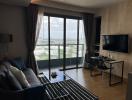 Modern living room with city view through large windows