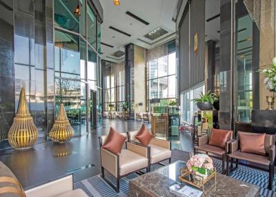 Modern lobby area with high ceilings and luxurious decor