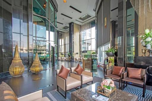 Modern lobby area with high ceilings and luxurious decor