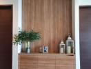 Elegant wooden feature wall with decorative items in a modern living space