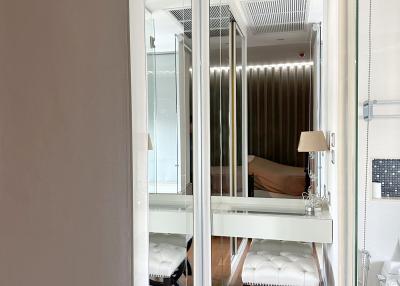 Modern bedroom interior with reflective closet doors