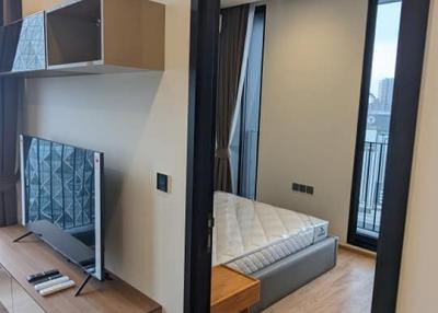 Modern bedroom with air conditioning and balcony access