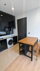 Modern kitchen with dining area and appliances