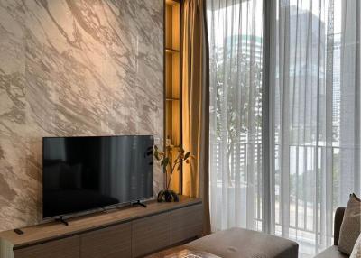Modern living room with marble wall and large window