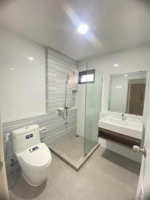 Modern bathroom with walk-in shower and sleek fixtures