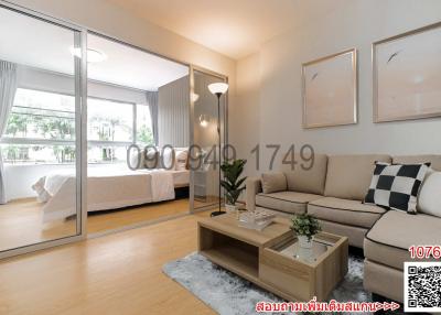 Modern living room with elegant decor, large sliding doors, and adjoining bedroom