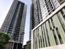 Modern high-rise residential buildings with entrance and clear sky