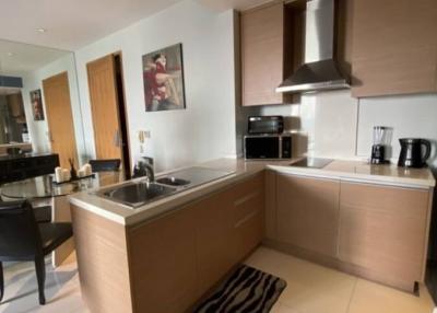 Modern kitchen with stainless steel appliances and wooden cabinets