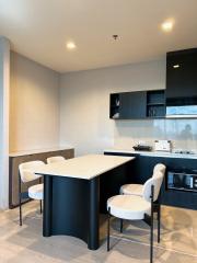 Modern kitchen interior with island and bar stools