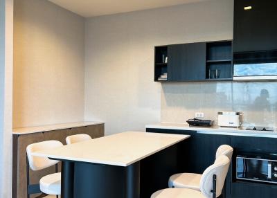 Modern kitchen interior with island and bar stools