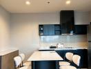 Modern kitchen with center island and bar stools