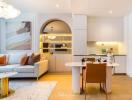 Modern open-plan living room with integrated kitchen space, bright interior design