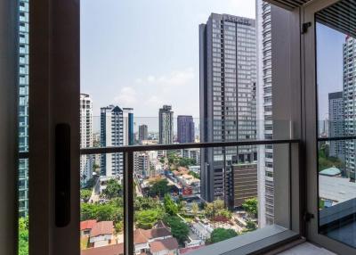 View from the balcony of a high-rise apartment overlooking the city